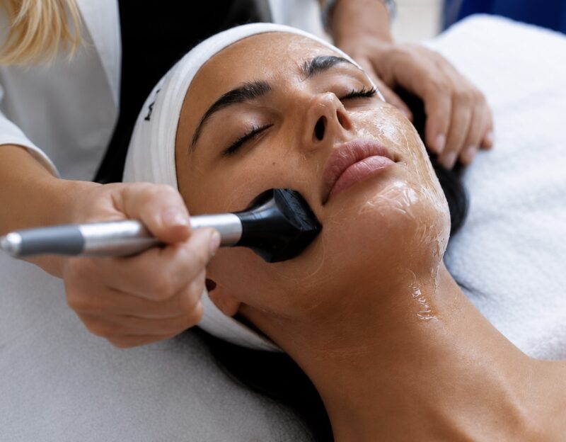 Client receiving a Forma® skin tightening treatment to improve skin firmness, elasticity and overall skin quality.